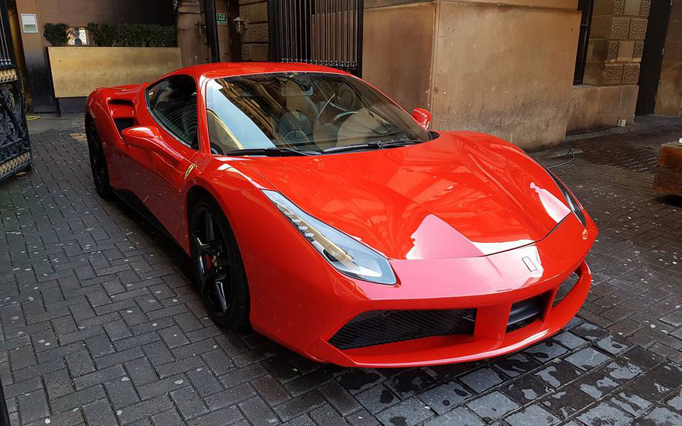 Red Ferrari 488 outside The Merchant Hotel in Belfast